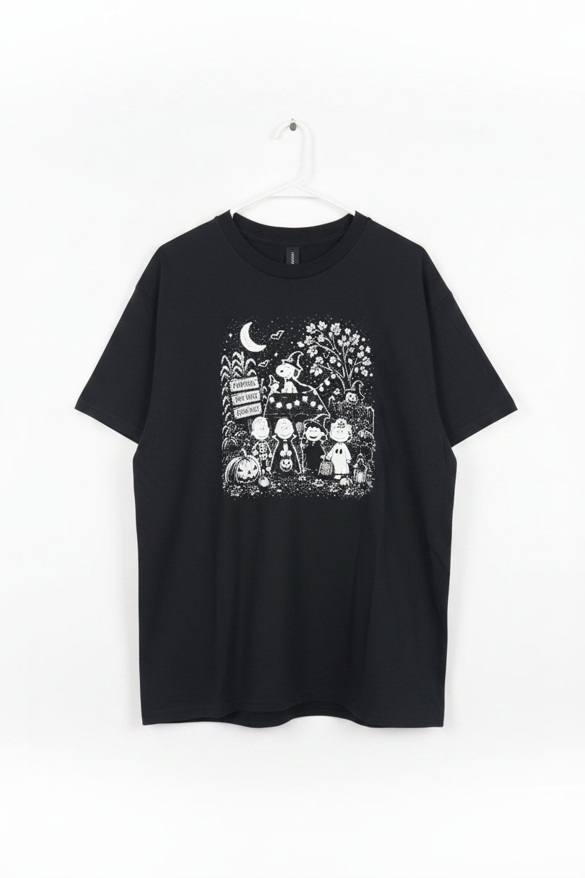 Black Peanuts Halloween pumpkin patch graphic tee on white studio background